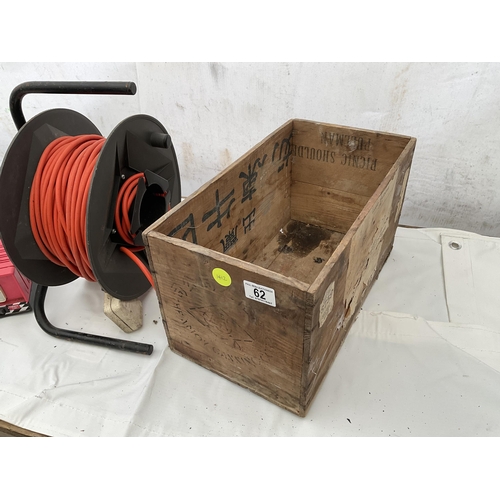 62 - WOODEN BOX ELECTRIC EXTENSION LEAD ON REEL  AND BATTERY CHARGER W/O