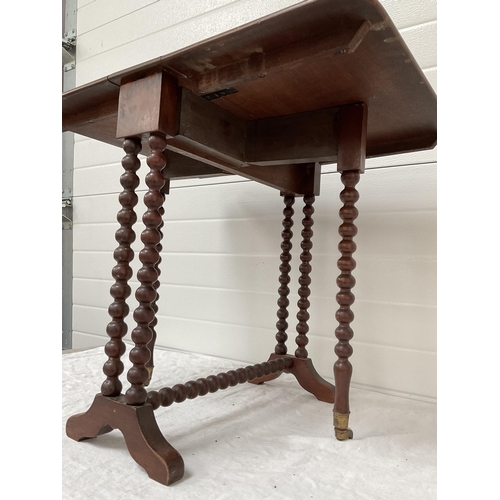 79 - VICTORIAN WALNUT SUTHERLAND TABLE WITH BOBBIN LEG DECORATION AND ORIGINAL CASTORS OF SMALL PROPORTIO... 