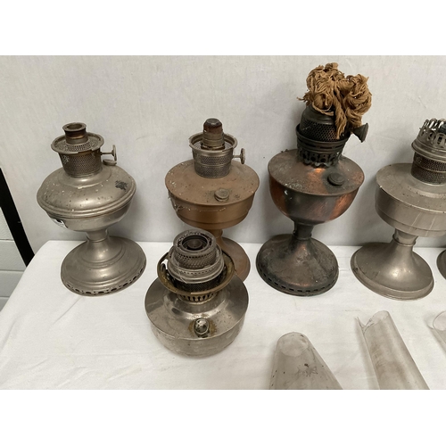 40 - QTY OF PARAFFIN LAMPS, CHIMNEYS ETC