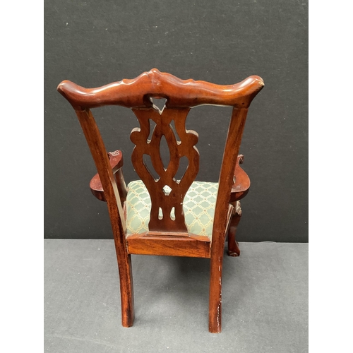 150 - REPRODUCTION CARVED MAHOGANY DOLLS ARMCHAIR WITH DECORATIVE BACK ON BALL & CLAW FEET OF SMALL PROPOR... 