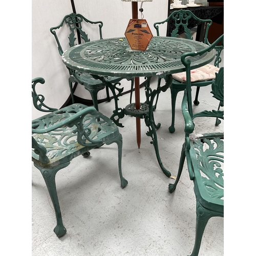 283 - ORNATE GARDEN TABLE AND 4 MATCHING ARMCHAIRS C/W BROLLY - TABLE H27