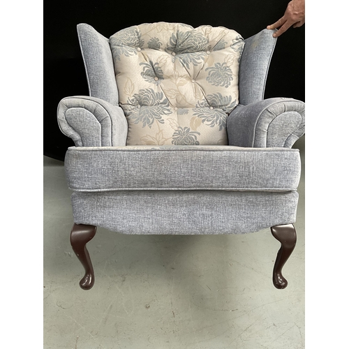 286 - BLUE PATTERNED UPHOLSTERED FIRESIDE CHAIR ON CABRIOLE LEGS