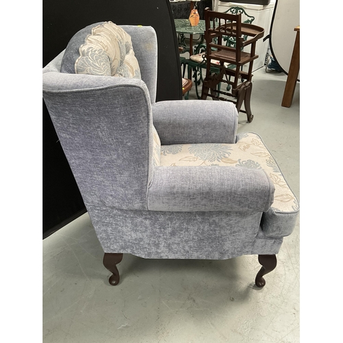 286 - BLUE PATTERNED UPHOLSTERED FIRESIDE CHAIR ON CABRIOLE LEGS