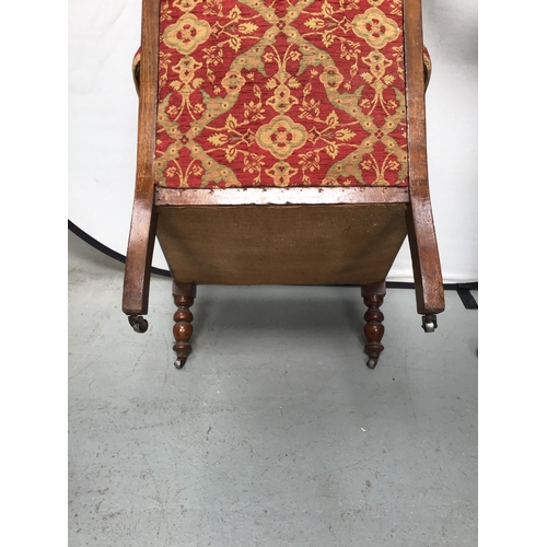 351 - EDWARDIAN OAK UPHOLSTERED ARMCHAIR ON TURNED LEGS AND ORIGINAL CASTORS