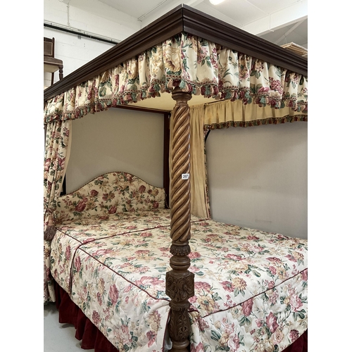 222 - MAHOGANY HEAVILY CARVED FOUR POSTER BED C/W SPIRAL DESIGN FLY AWAY  MAHOGANY CORNICE FLORAL UPHOLSTE... 