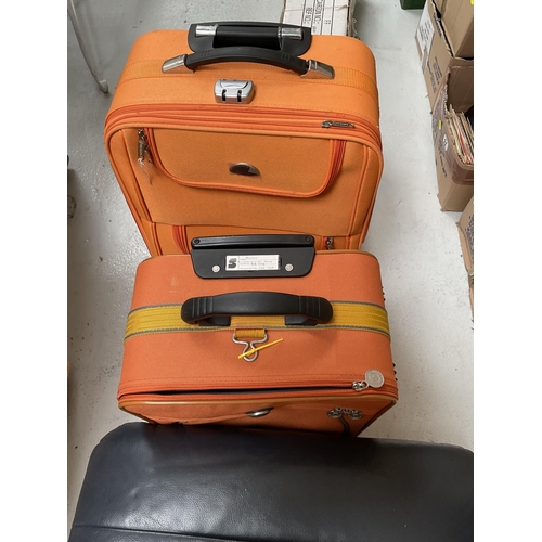 44 - 2 ORANGE SUITCASES, LEATHER FOOTSTOOL, HOUSEHOLD ITEMS