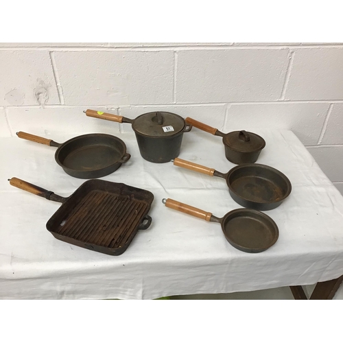 51 - BOX OF CAST IRON SAUCEPANS