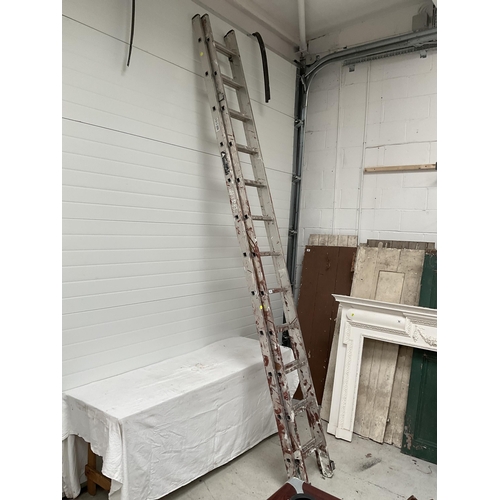 127 - LARGE ALUMINIUM EXTENDING LADDERS - 12 RUNG