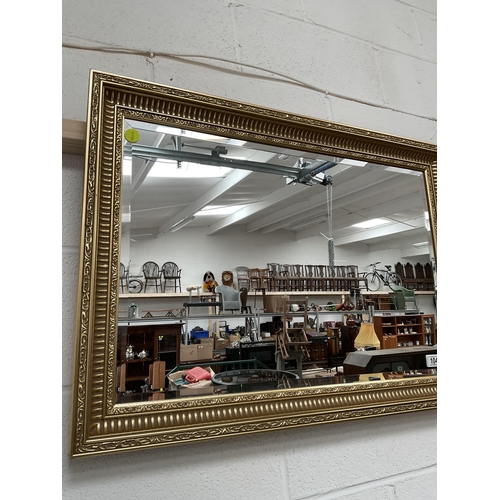 104 - REPRODUCTION GILT FRAMED BEVEL EDGE WALL MIRROR 33 X 24