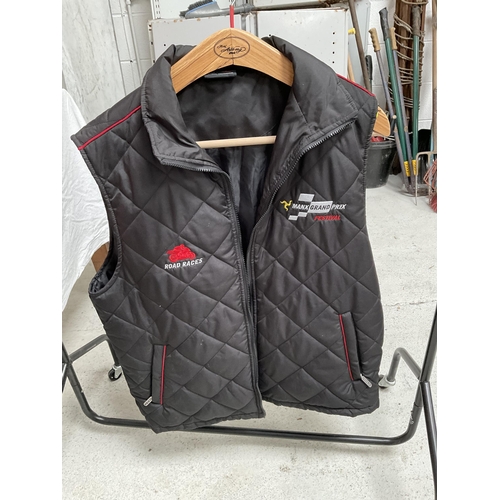 120 - TT ROAD RACING WAISTCOAT AND TT ISLE OF MAN JACKET AND  F 1 FLAG