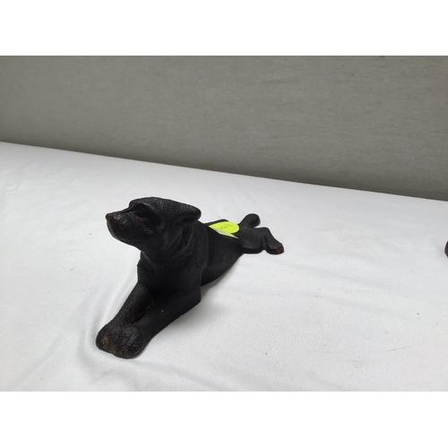 169 - METAL DOG DOOR STOP AND A SEATED LADY FIGURE