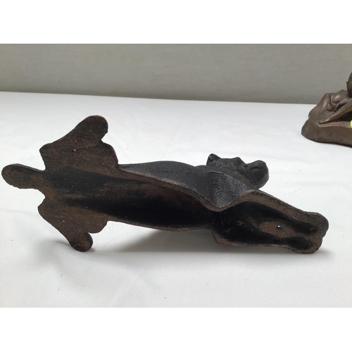 169 - METAL DOG DOOR STOP AND A SEATED LADY FIGURE