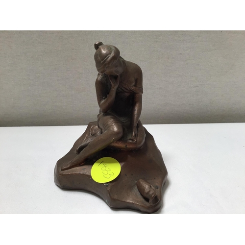 169 - METAL DOG DOOR STOP AND A SEATED LADY FIGURE