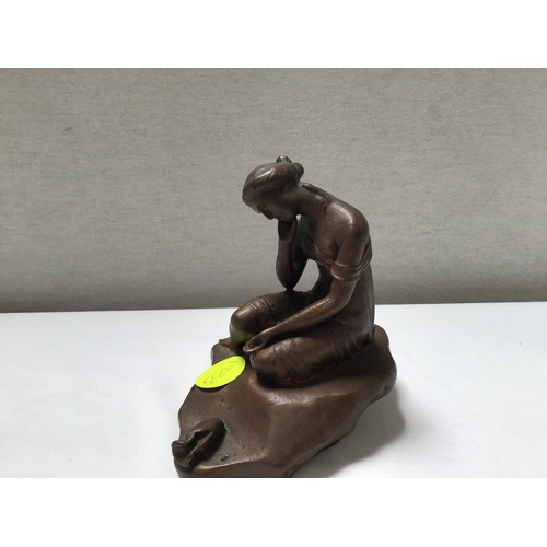 169 - METAL DOG DOOR STOP AND A SEATED LADY FIGURE