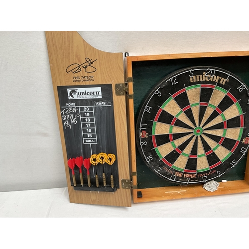 35 - DART BOARD IN CABINET 20.5 X 25