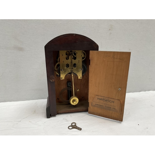 53 - EDWARDIAN MAHOGANY CASED MANTLE CLOCK WITH VISIBLE ESCAPEMENT GLASS CRACKED PENDULUM AND KEY APPEARS... 