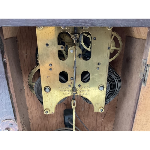 53 - EDWARDIAN MAHOGANY CASED MANTLE CLOCK WITH VISIBLE ESCAPEMENT GLASS CRACKED PENDULUM AND KEY APPEARS... 