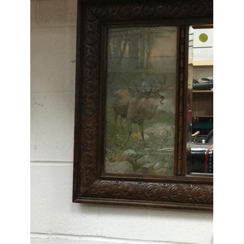 124 - CARVED OAK FRAMED OVER MANTLE MIRROR FLANKED BY STAG PICTURES