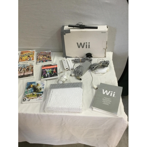 129 - WII CONSOLE GAMES AND FIT BOARD