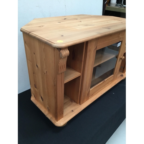 253 - MODERN PINE CORNER TV STAND WITH GLASS CENTRAL DOOR H 21