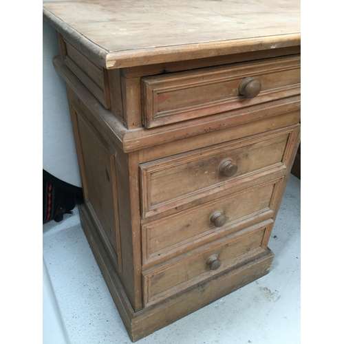 258 - WAXED PINE TWIN PEDESTAL KNEE HOLE DESK OF 9 DRAWERS A/F H 30