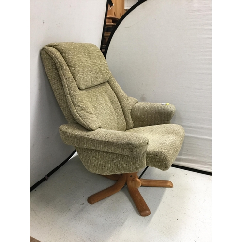 295 - GREEN FABRIC SWIVEL AND RECLINING CHAIR COMPLETE WITH FOOTSTOOL