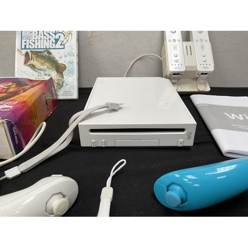 182 - NINTENDO WII WITH ASSESSORIES AND GAMES