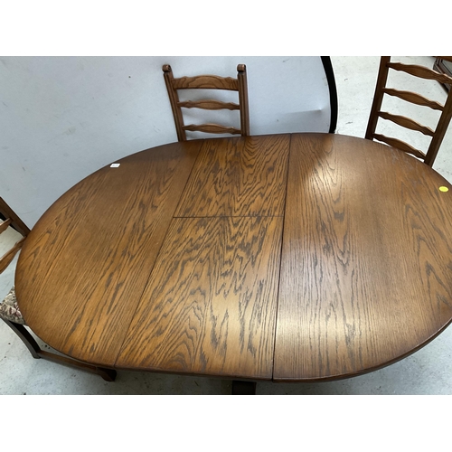 379 - BADGED OLD CHARM CARVED PEDESTAL CIRCULAR EXTENDING DINING TABLE AND 4 MATCHING RAILBACK CHAIRS ON T... 