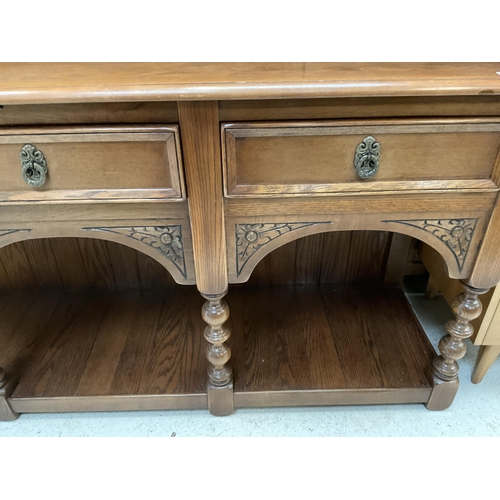 381 - BADGED OLD CHARM DRESSER WITH OPEN RACK CARVED FREEZE BASE WITH 3 DRAWERS  ON 4 FRONT TURNED LEGS WI... 