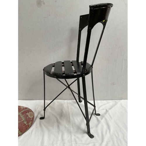 389 - CAST IRON STRETCHERED GARDEN SEAT WITH CUSHION