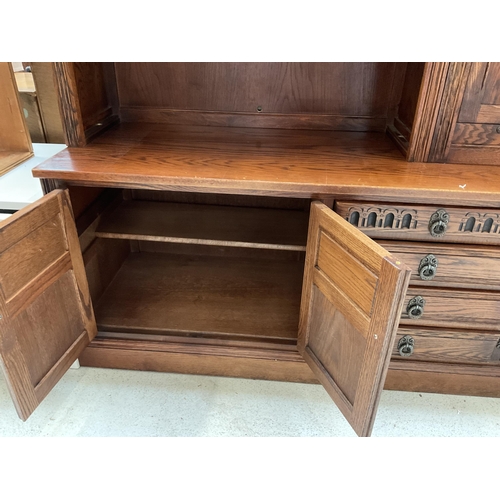 416 - BADGED OLD CHARM LOUNGE UNIT TOP WITH OPEN SHELVES 2 GLASS LEADED DOORS WITH DROP DOWN BUREAU WITH L... 