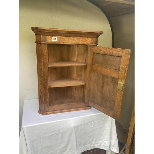 304 - OAK CARVED CORNER CABINET WITH SINGLE DOOR WITH CARVED PANEL COMPLETE WITH KEY - H29