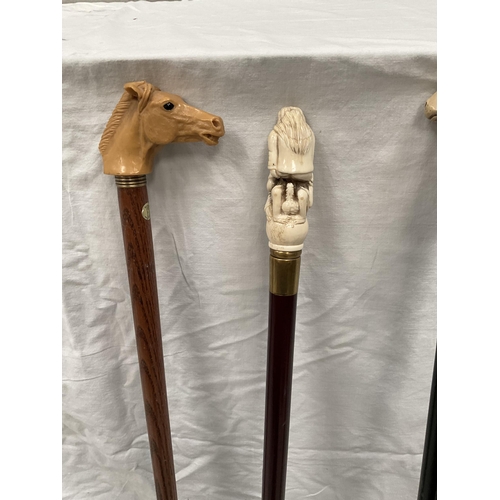 9 - 3 WALKING CANES WITH DECORATIVE CARVED HANDLES (RAMS HEAD, EROTIC, HORSES HEAD) - H 37