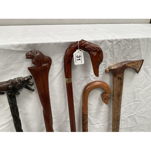 31 - QTY OF CARVED HANDLED WALKING STICKS
Longest 37