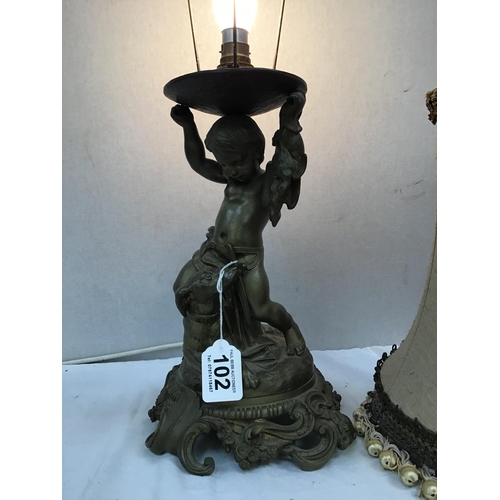 102 - HEAVY BRASS TABLE LAMP DECORATED WITH HUNTING DOG AND CHILD COMPLETE WITH SHADE H23