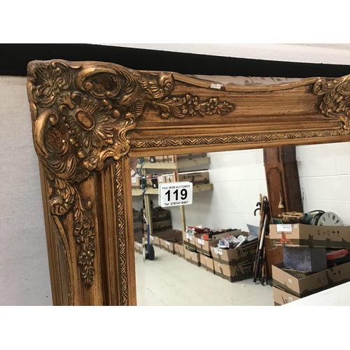 119 - REPRODUCTION ORNATE GILT FRAMED BEVEL EDGE WALL MIRROR - W30