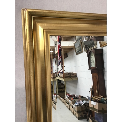 124 - LARGE REPRODUCTION GILT FRAMED HALL MIRROR WITH BEVEL EDGE GLASS H66