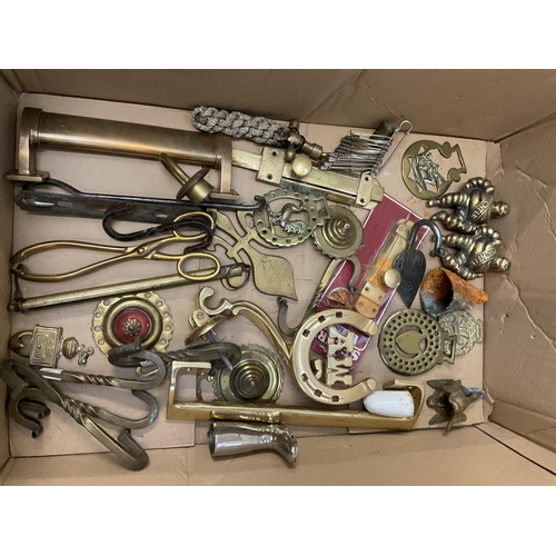 202 - BOX OF BRASSWARE TO INCLUDE BRASS TAPS TRIVETS BELLS FIRE DOGS AND EARLY CAST METAL LAMP