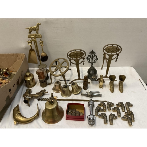 202 - BOX OF BRASSWARE TO INCLUDE BRASS TAPS TRIVETS BELLS FIRE DOGS AND EARLY CAST METAL LAMP