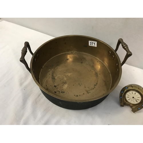 371 - EARLY VICTORIAN TWIN HANDLED BRASS PAN, A VINTAGE HORSE SHOE MANTLE CLOCK AND A BRASS WALL SHELF