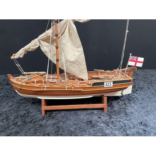 423 - MODEL SAILING BOAT ON STAND COMPLETE WITH SAILS - H21