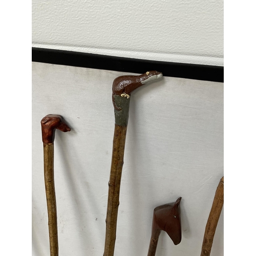 424 - QTY OF WALKING CANES WITH CARVED ANIMAL HEADS - LONGEST 59