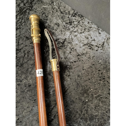 428 - 2 MODERN WALKING CANES 1 FITTED WITH A BRASS TELESCOPE AND 1 WITH A COMPASS - LONGEST 36