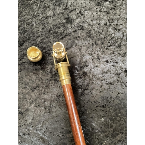 428 - 2 MODERN WALKING CANES 1 FITTED WITH A BRASS TELESCOPE AND 1 WITH A COMPASS - LONGEST 36