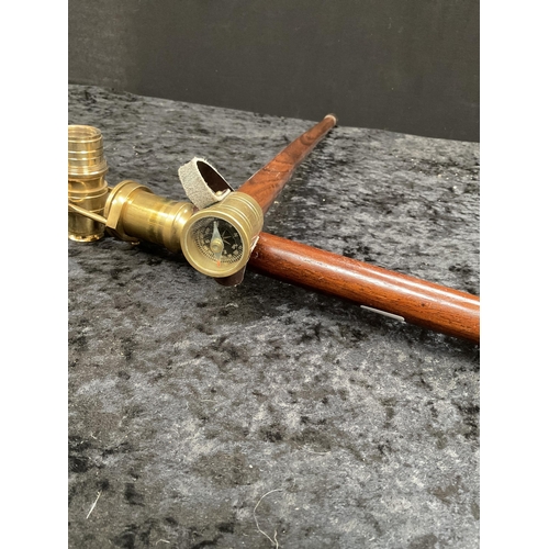 428 - 2 MODERN WALKING CANES 1 FITTED WITH A BRASS TELESCOPE AND 1 WITH A COMPASS - LONGEST 36