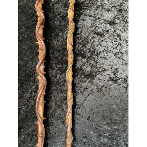 429 - 2 CARVED WALKING STICKS WITH SNAKE DECORATION - LONGEST 43