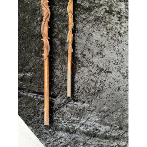 429 - 2 CARVED WALKING STICKS WITH SNAKE DECORATION - LONGEST 43