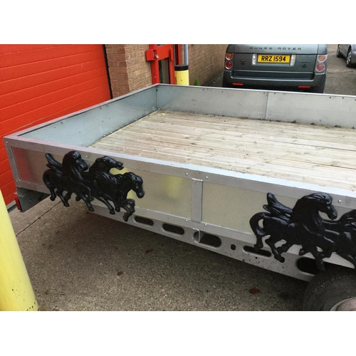 497 - LARGE TWIN AXLE FLAT BED TRAILER WITH RIGID SIDES DECORATED TO THE SIDES WITH GALLOPING HORSES AND T... 