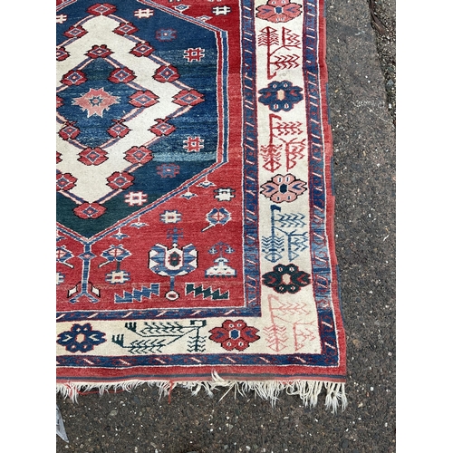 32 - 2 VINTAGE PATTERNED RUGS 
84 X 47