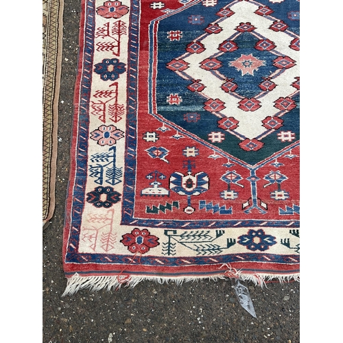 32 - 2 VINTAGE PATTERNED RUGS 
84 X 47